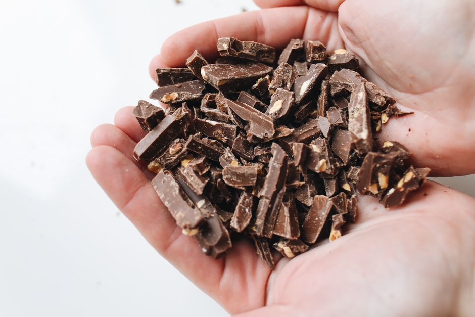 Chopped dark chocolate pieces ready for a batch.