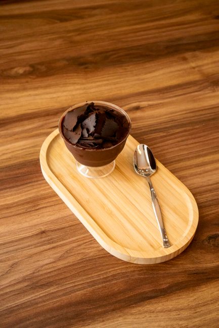 A bowl of chocolate mousse ready to taste.